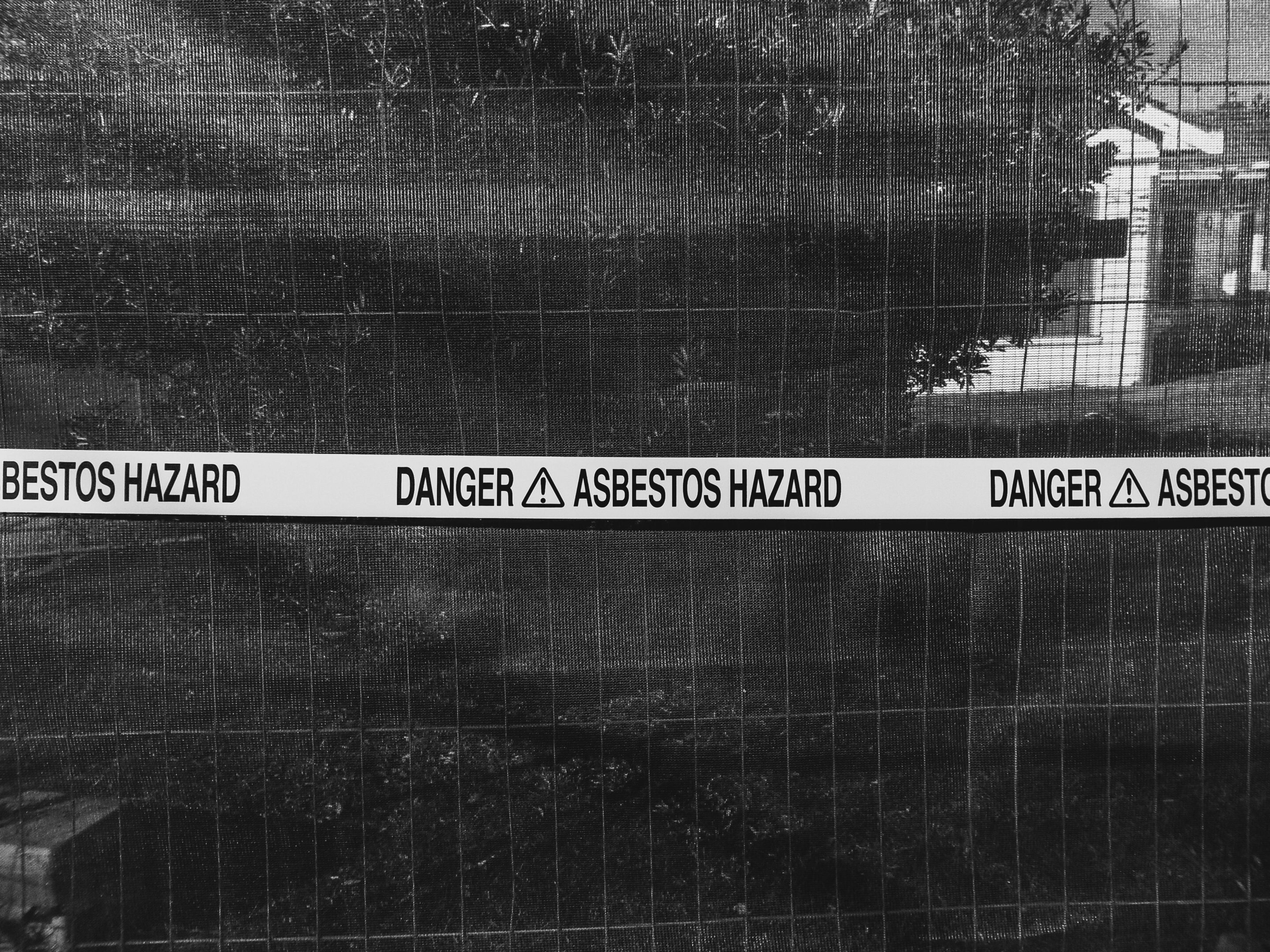 Asbestos Photo by Sonny Sixteen: https://www.pexels.com/photo/tape-with-warning-sign-in-front-of-fence-13364320/