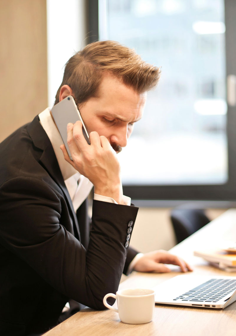Whistleblower - Man Having a Phone Call In-front of a Laptop<br />
Personal Injury