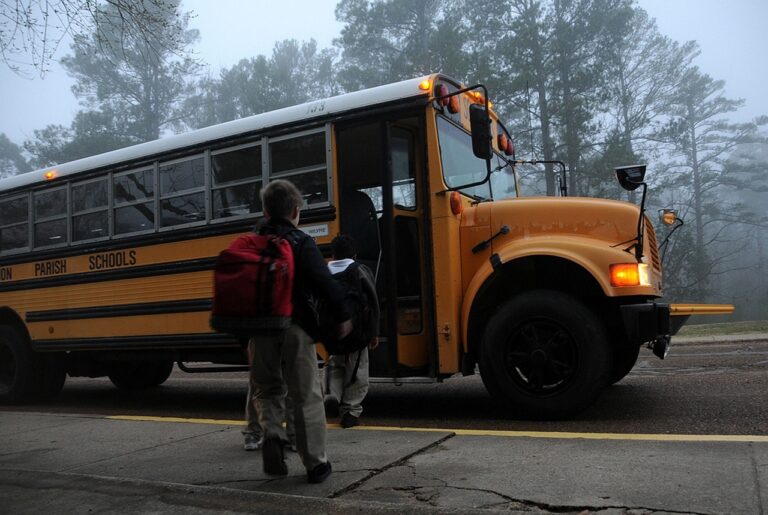 Child walking onto a school bus